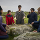 Angus Imrie (center) plays Young Merlin and steals the show in The Kid Who Would Be King.